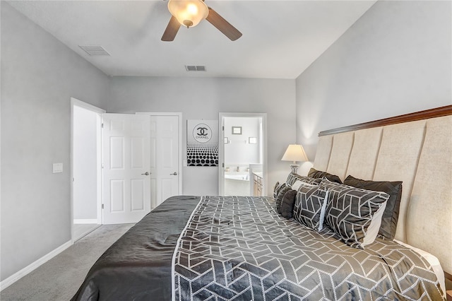 1028 Orange Cosmos Blvd, Davenport, FL 33837 - bedroom with carpet, ceiling fan, and ensuite bathroom