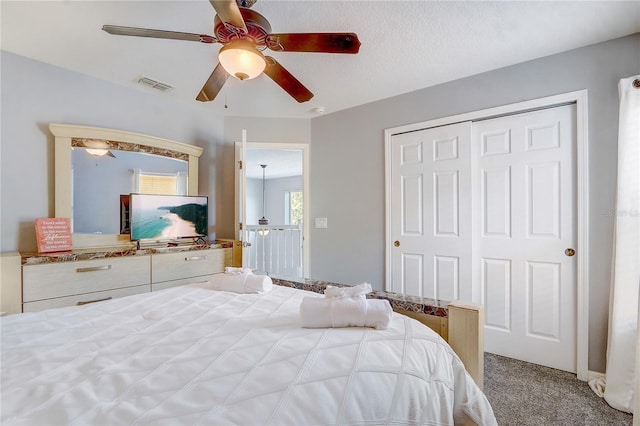 1028 Orange Cosmos Blvd, Davenport, FL 33837 - carpeted bedroom featuring a closet and a ceiling fan