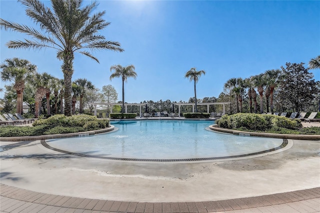 1028 Orange Cosmos Blvd, Davenport, FL 33837 - community pool featuring a pergola
