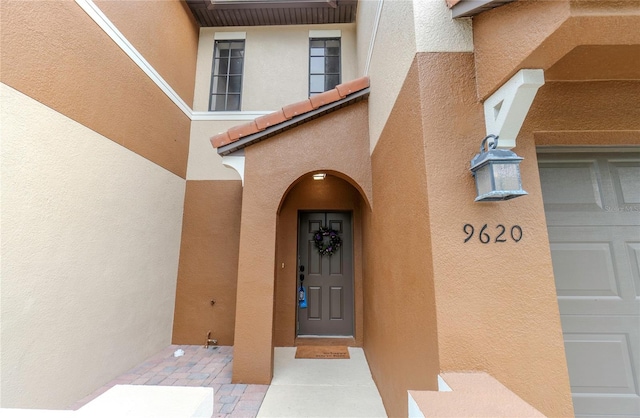 9620 Doris Ln, Orlando, FL 32829 - entrance to property featuring stucco siding