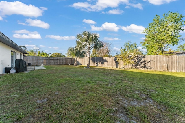 view of yard with a fenced backyard