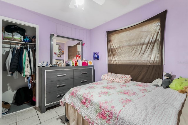 bedroom with ceiling fan, a closet, and light tile patterned flooring