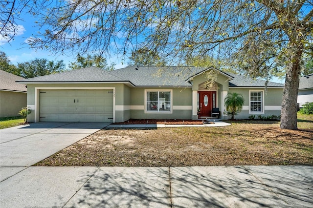 ranch-style home featuring stucco siding, concrete driveway, a garage, and roof with shingles