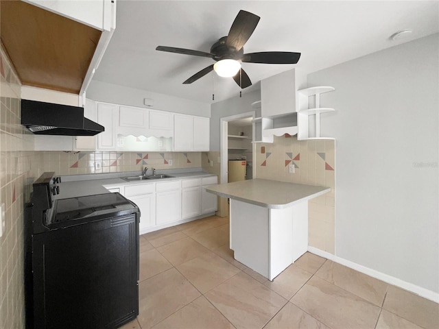 kitchen with backsplash, under cabinet range hood, a peninsula, stove, and open shelves