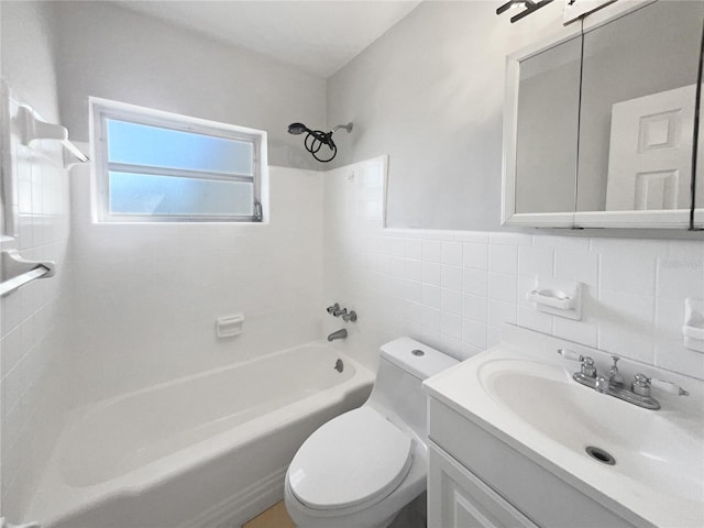 bathroom featuring vanity, wainscoting, shower / tub combination, toilet, and tile walls