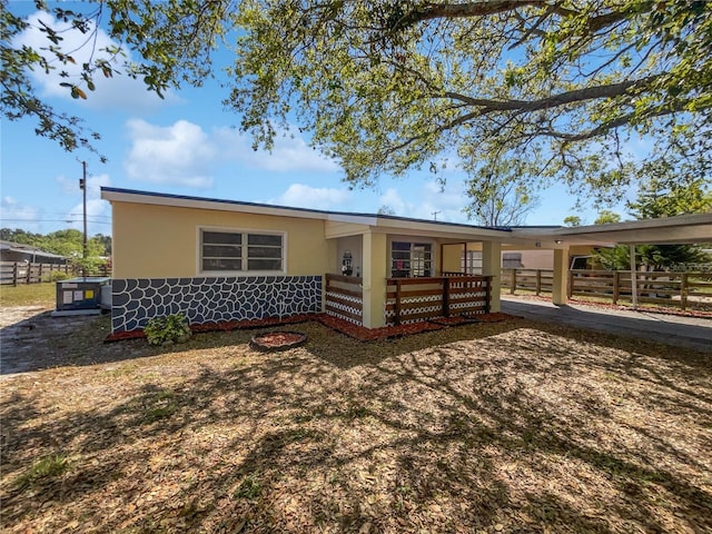 ranch-style house with fence