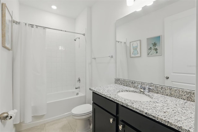 bathroom featuring tile patterned flooring, vanity, toilet, and shower / tub combo