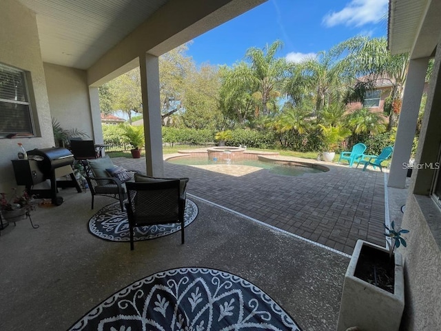 view of patio featuring a grill and a pool with connected hot tub