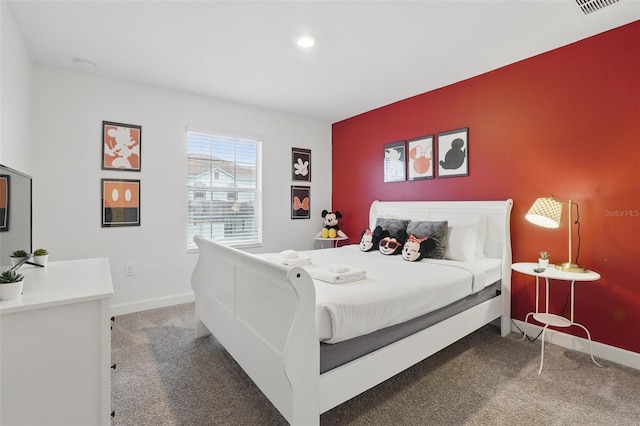 bedroom featuring carpet flooring, visible vents, and baseboards