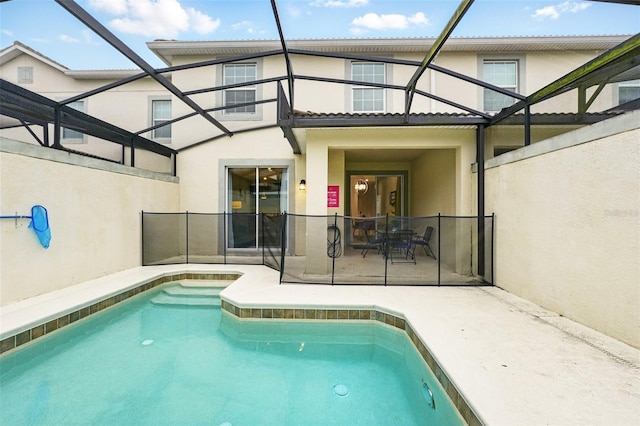 pool with a lanai and a patio