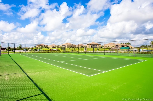 view of tennis court with fence