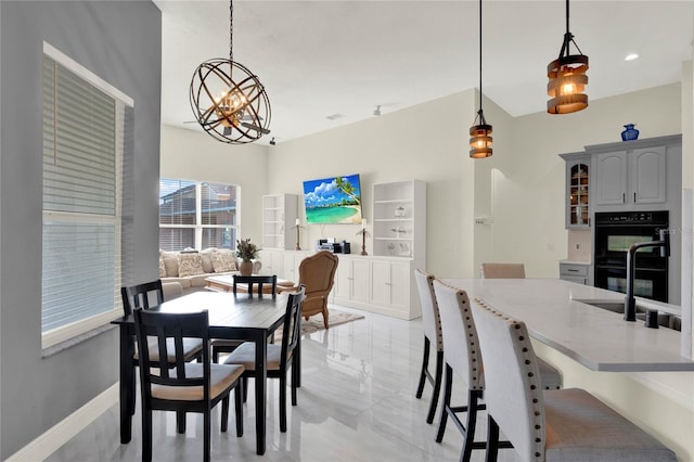 dining space with a notable chandelier, recessed lighting, visible vents, and baseboards