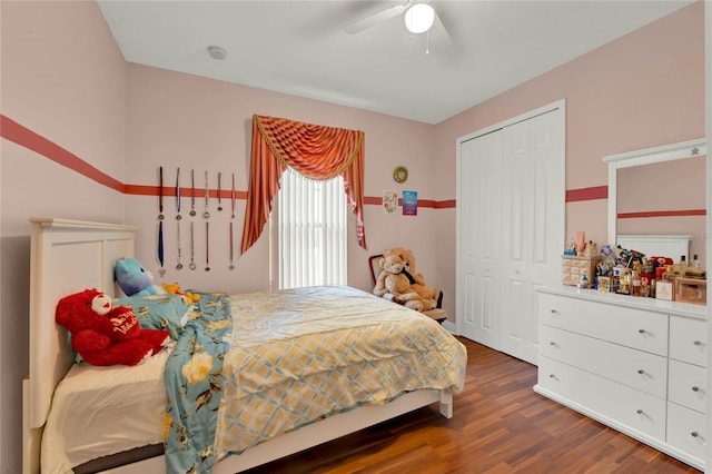 bedroom featuring a closet, wood finished floors, and a ceiling fan