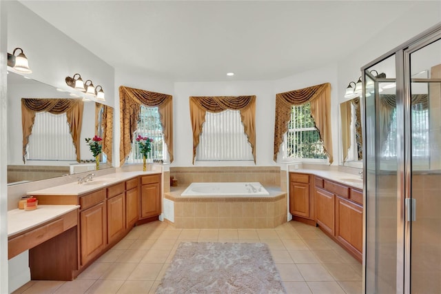 full bathroom featuring tile patterned floors, vanity, and a garden tub