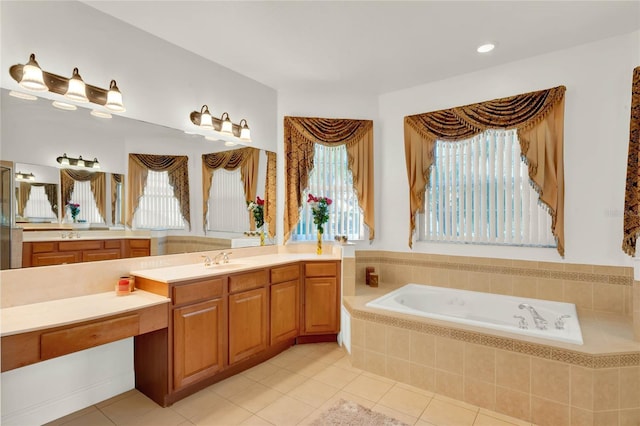 full bath with tile patterned floors, vanity, and a garden tub