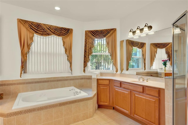 bathroom with vanity, a bath, and tile patterned flooring