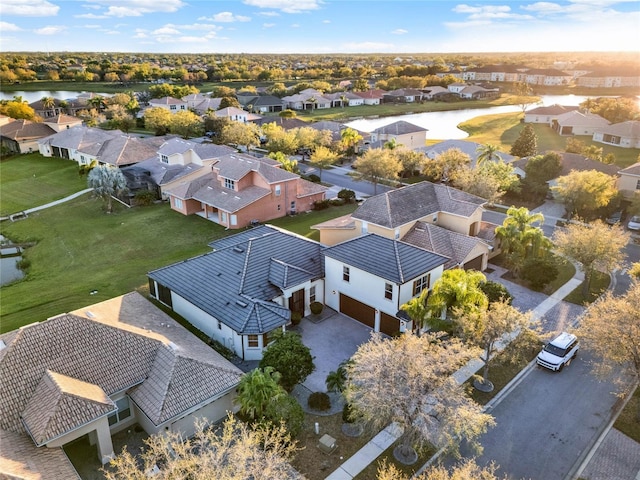 birds eye view of property featuring a residential view and a water view