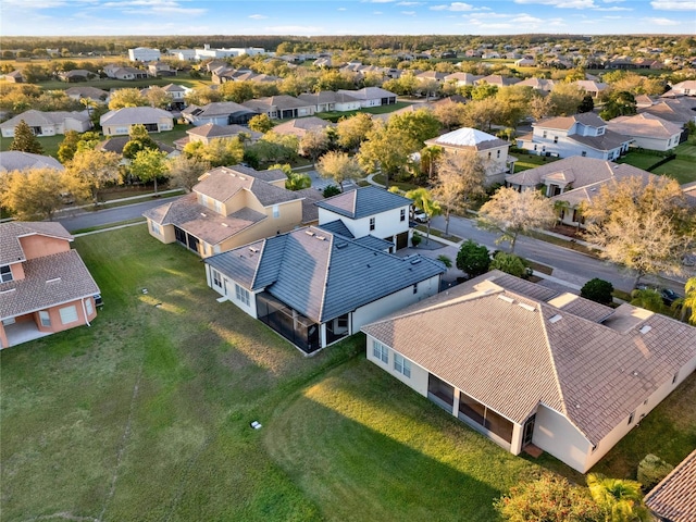 birds eye view of property with a residential view