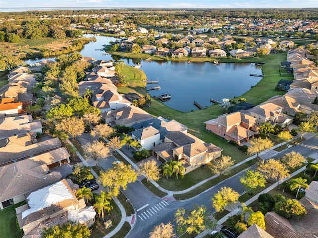 bird's eye view featuring a residential view and a water view