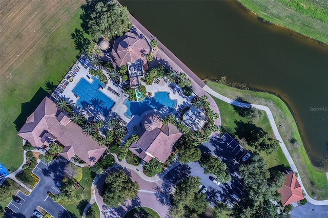 birds eye view of property with a water view