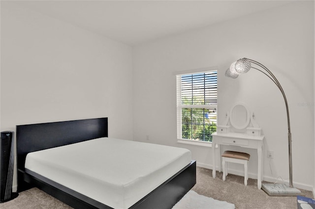 carpeted bedroom with baseboards