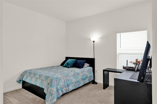 bedroom featuring baseboards and carpet floors