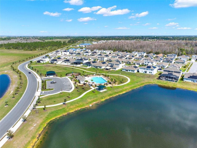 drone / aerial view with a residential view and a water view