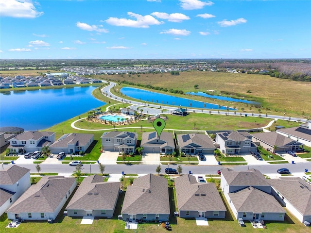 bird's eye view with a residential view and a water view