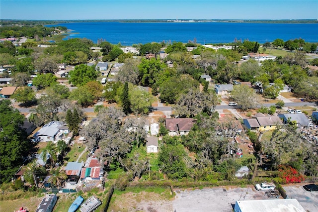 drone / aerial view featuring a residential view and a water view