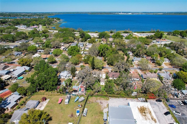 birds eye view of property with a residential view and a water view