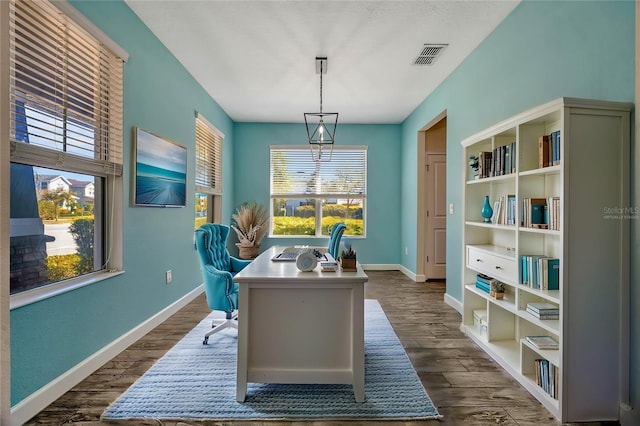 office with visible vents, baseboards, and dark wood finished floors