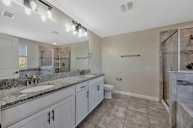 bathroom with a sink, visible vents, and a stall shower