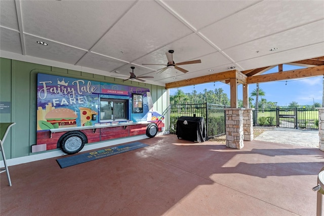 view of patio / terrace with a ceiling fan, fence, and grilling area