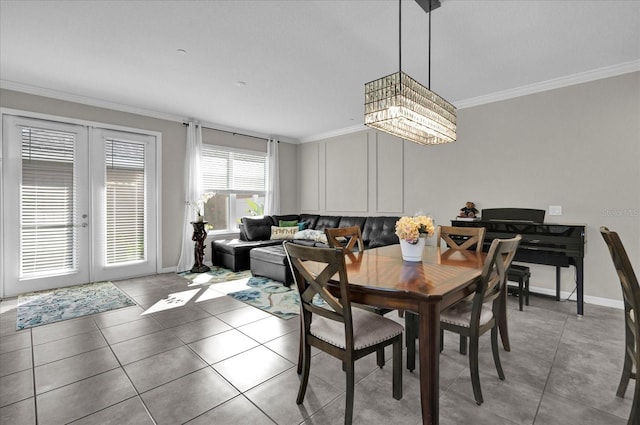 dining room featuring light tile patterned floors, french doors, crown molding, and baseboards