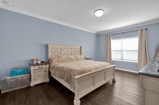 bedroom with dark wood-style floors, crown molding, and baseboards