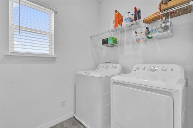 laundry area with baseboards, independent washer and dryer, and laundry area