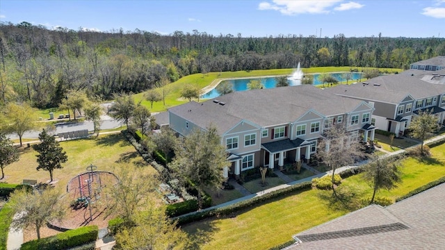 drone / aerial view with a water view and a wooded view