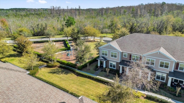 birds eye view of property with a wooded view