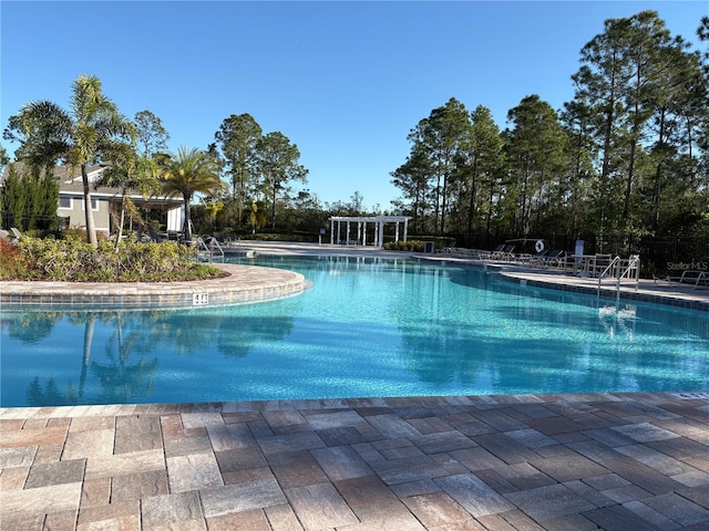 community pool featuring a patio area