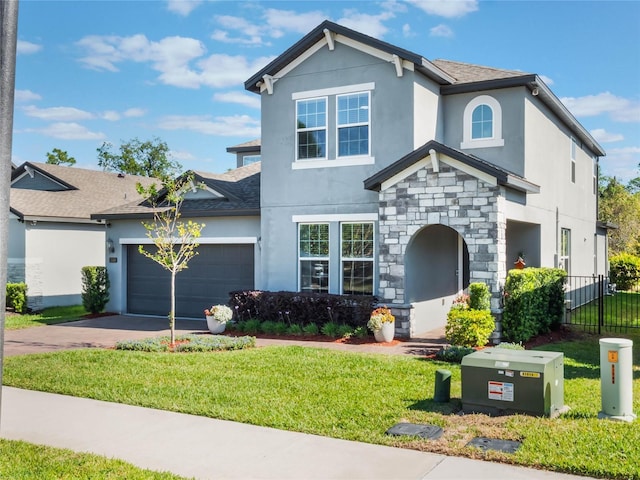 753 Daybreak Pl, Longwood, FL 32750 - traditional-style house featuring stucco siding, a front lawn, stone siding, concrete driveway, and a garage