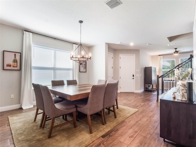 753 Daybreak Pl, Longwood, FL 32750 - dining area with visible vents, baseboards, stairway, an inviting chandelier, and light wood-style floors