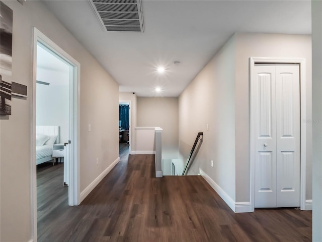 753 Daybreak Pl, Longwood, FL 32750 - hall with visible vents, an upstairs landing, baseboards, and wood finished floors