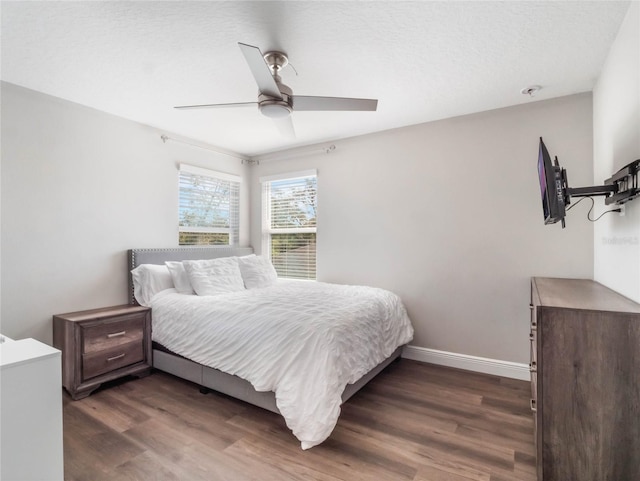 753 Daybreak Pl, Longwood, FL 32750 - bedroom with baseboards, dark wood-style floors, and a ceiling fan