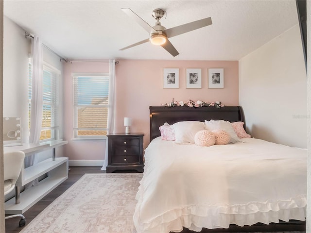 753 Daybreak Pl, Longwood, FL 32750 - bedroom featuring a ceiling fan, dark wood-style flooring, and baseboards