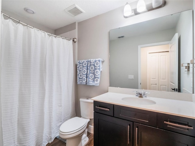 753 Daybreak Pl, Longwood, FL 32750 - full bathroom with visible vents, toilet, vanity, and wood finished floors