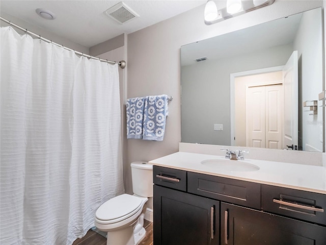 753 Daybreak Pl, Longwood, FL 32750 - bathroom featuring vanity, toilet, wood finished floors, and visible vents