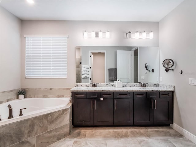 753 Daybreak Pl, Longwood, FL 32750 - bathroom with double vanity, a garden tub, and a sink