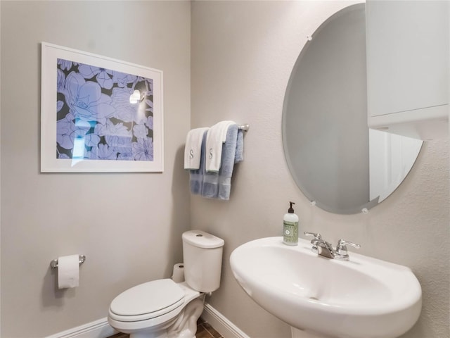 753 Daybreak Pl, Longwood, FL 32750 - bathroom with toilet, baseboards, and a sink
