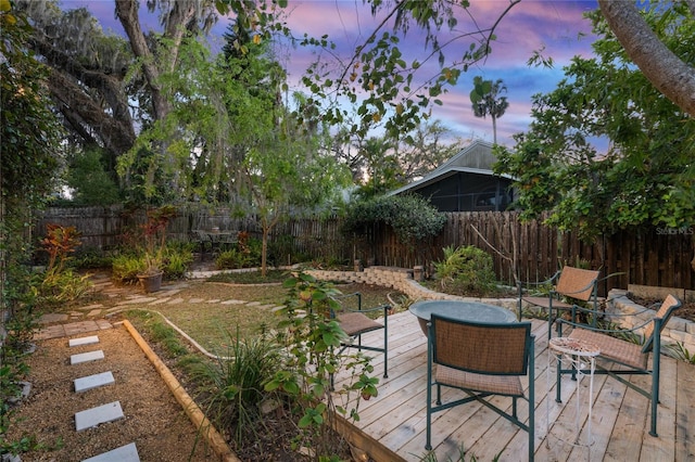 view of yard featuring a wooden deck and a fenced backyard