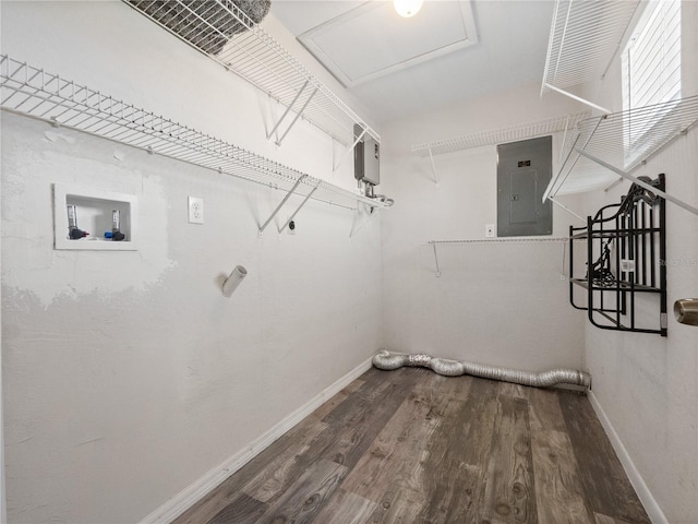 laundry area with hookup for a washing machine, wood finished floors, baseboards, laundry area, and electric panel